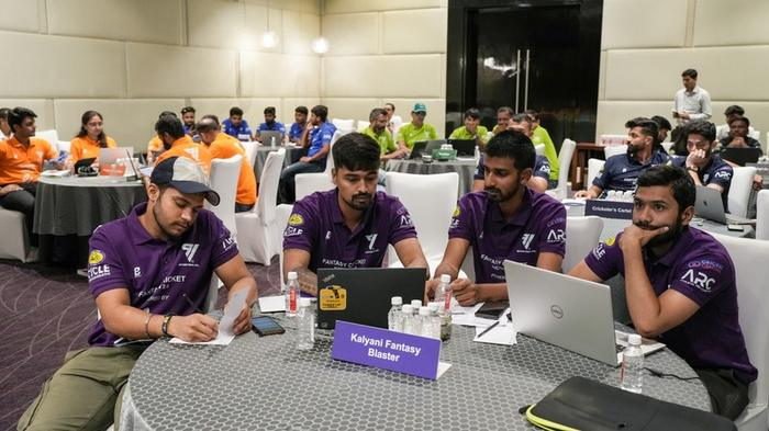 Teams at their tables during a 91 Fantasy Cricket Auction