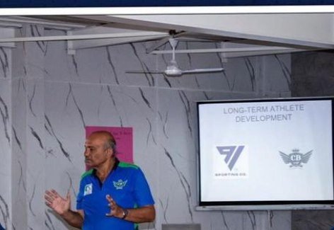 A coach presenting on long-term athlete development