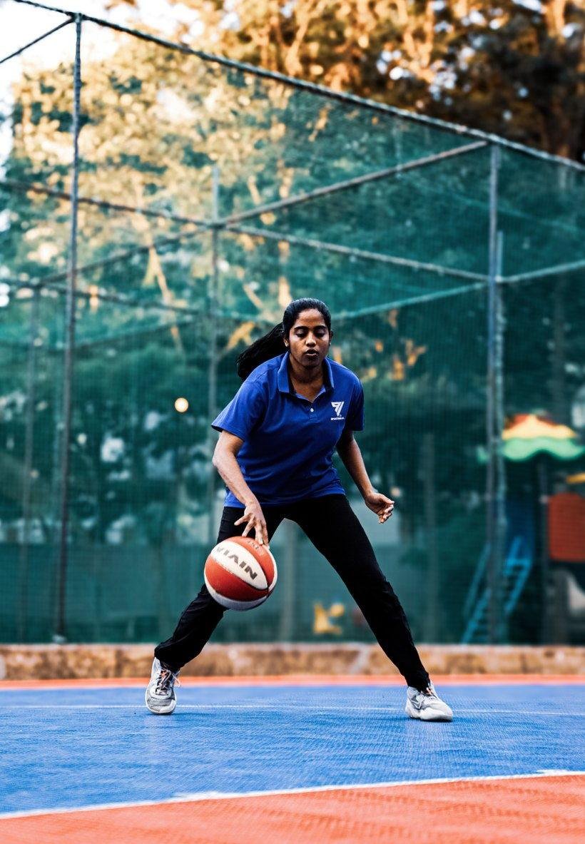 A player shooting on the rooftop basketball court