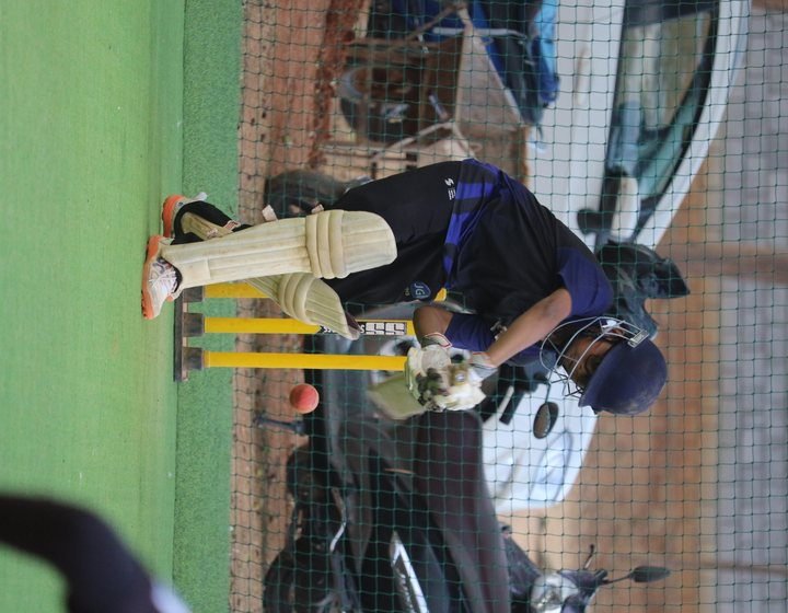A batsman playing a shot in the practice nets